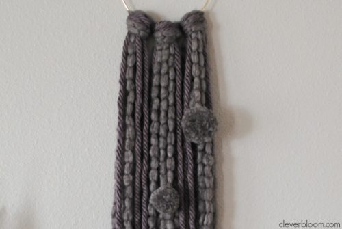 This Ring Wall Hanging is an inexpensive and simple way to add a little bohemian style into your home.