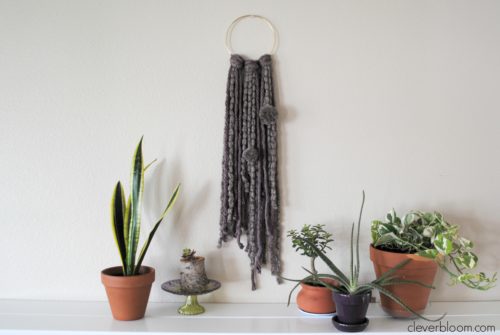 This Ring Wall Hanging is an inexpensive and simple way to add a little bohemian style into your home.