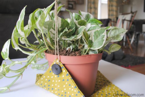 This DIY Plant Hanger is such a fun way to display your favorite plant! Grab that fabric you have laying around the house and visit cleverbloom.com for a full tutorial.