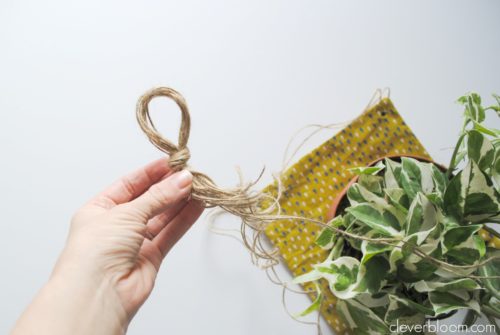 This DIY Plant Hanger is such a fun way to display your favorite plant! Grab that fabric you have laying around the house and visit cleverbloom.com for a full tutorial.