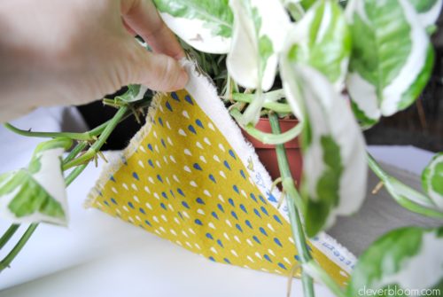 This DIY Plant Hanger is such a fun way to display your favorite plant! Grab that fabric you have laying around the house and visit cleverbloom.com for a full tutorial.