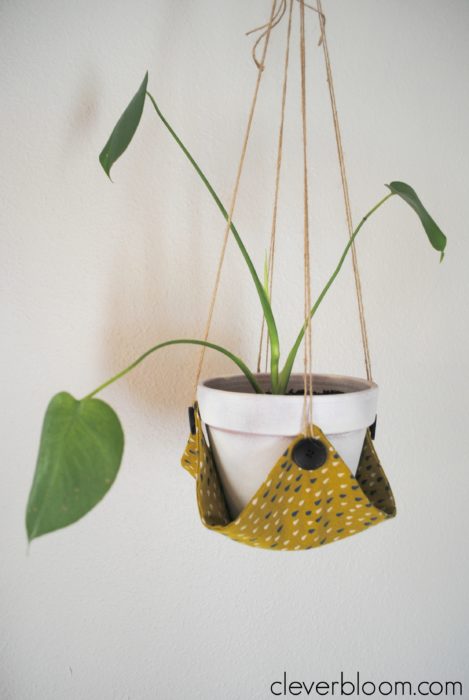 This DIY Plant Hanger is such a fun way to display your favorite plant! Grab that fabric you have laying around the house and visit cleverbloom.com for a full tutorial.