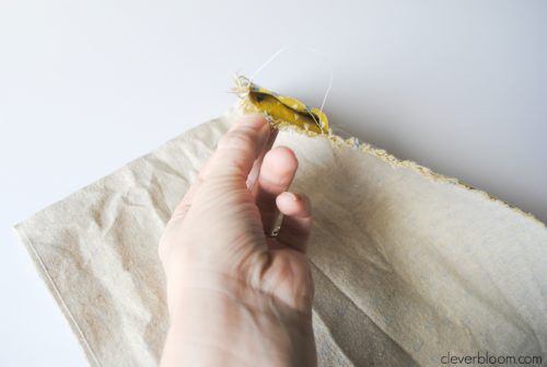 This DIY Plant Hanger is such a fun way to display your favorite plant! Grab that fabric you have laying around the house and visit cleverbloom.com for a full tutorial.